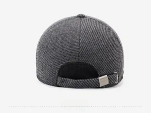 Close-up of the grey textured fabric and adjustable metal buckle on back of the cap