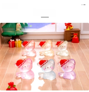 Close-up of six colorful resin Christmas cats for DIY dollhouse landscape decor