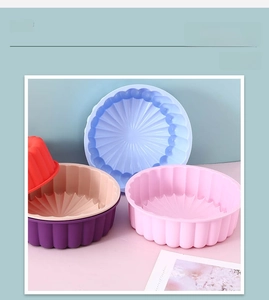 Macro detail of various colors of sun flower silicone cake molds showing ripple edges