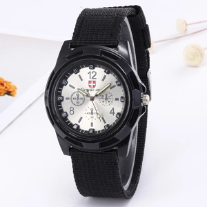 Macro detail of men's military watch with black canvas strap and silver luminous dial