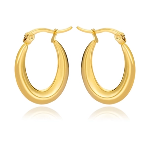 Macro shot of polished gold U-shaped hoop earrings with smooth bamboo joint texture