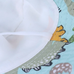 Detail of blue sun hat showing breathable white lining and adjustable elastic chin strap