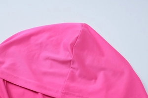Detail view of double stitching on a rose pink hoodie with flat jersey knit fabric