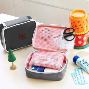 Portable double-sided travel medical pouch with red cross and mesh compartments