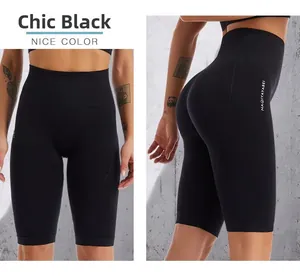 Detail of black high-waisted fitness shorts with tummy control and seamless compression