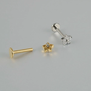 Detail of G23 titanium labret studs with flower zircon top and internal thread structure