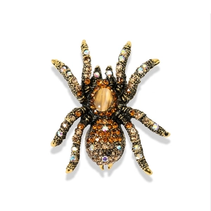 Vintage spider brooch with opal and rhinestones in antique gold finish for suits