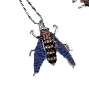 Jeweled bee insect pendant necklace with colorful crystals on a silver chain