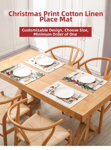 Festive Christmas table mats with holiday patterns and cutlery on a wooden surface