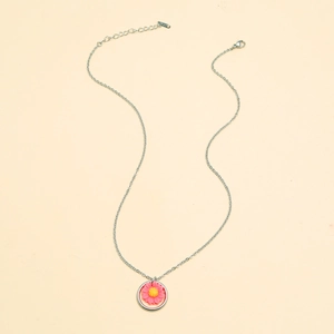 Close-up of silver chain necklace with pink sunflower pendant and lobster clasp detail