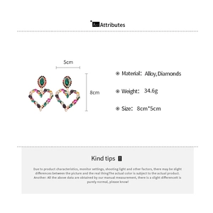 Detailed view of oversized heart earrings with colorful rhinestones and dimensions