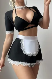 Macro detail of sexy maid outfit featuring black satin and white lace trim apron