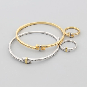 Elegant gold and silver copper bangle and ring jewelry set with inlaid cubic zirconia