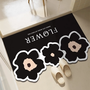Absorbent floral bathroom mat in black irregular shape for home entrance and bathroom decor
