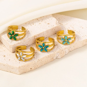 Set of four gold stainless steel open rings with vintage flower patterns and colorful stones