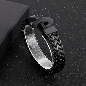 Detail shot of men's black stainless steel chain bracelet with a secure buckle clasp