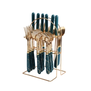 24-piece golden stainless steel cutlery set with green marble handles on metal stand