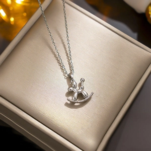Polished silver titanium steel necklace featuring a balloon horse pendant in a gift box