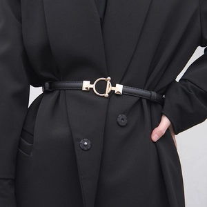 Slim black leather waist belt with gold horsebit buckle for women's dresses and blazers