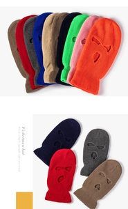 Detailed view of colorful three-hole ribbed knit balaclavas in various bright shades