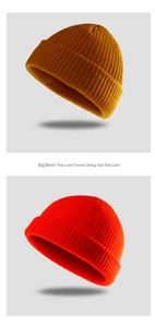 Detailed knit texture of ginger and bright orange skull caps for winter fashion