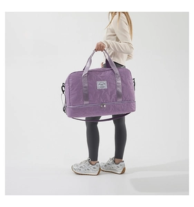 Detail of purple gym bag with star quilting pattern and side shoe compartment