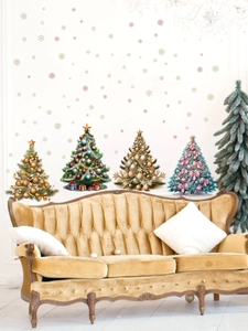 Christmas wall stickers with colorful trees and snowflakes on a white wall above a sofa