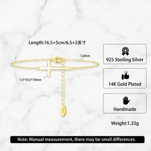 Minimalist S925 sterling silver cross bracelet with 14K gold plating on a silk background