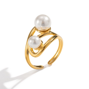 Macro detail of gold geometric open ring with dual pearls in a tiered offset design