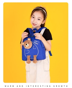 Blue kids backpack with plush bear detail and ergonomic design for girls