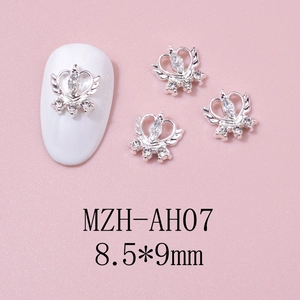 Detail of silver heart crown nail art charms with wings and rhinestones, size 8.5x9mm