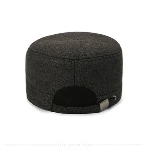 Detail view of the adjustable silver metal buckle and grey wool fabric on a flat top cap