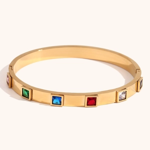 Luxury gold chain bracelet featuring multi-colored square-cut crystals and spring clasp