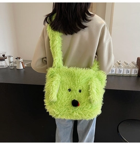 Close-up of the plush green puppy tote bag with soft faux fur and cute cartoon details