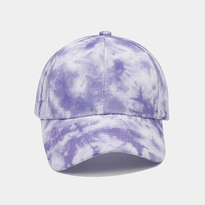 Detailed view of purple tie-dye baseball cap with reinforced stitching on curved brim
