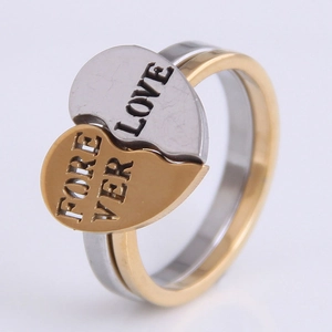 Detail of interlocking heart rings in gold and silver with Love Forever engraving