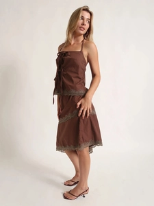 Brown two-piece set featuring halter bow top and midi skirt with lace trim details
