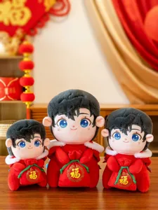 Detailed view of three festive Chinese New Year mascot dolls in traditional red outfits