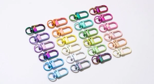 Close-up of colorful iridescent spring gate rings and key rings in neat arrangement
