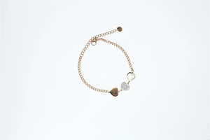 Detail of gold heart bracelet featuring crystal pavé, hollow metal and lobster clasp