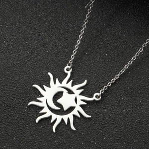 Detailed view of silver sun moon and star pendant on a fine O-chain necklace