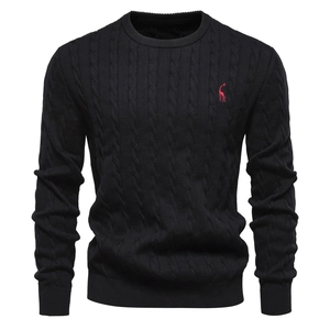 Detail of cable knit pattern and red giraffe embroidery on black men's sweater