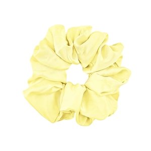 Detailed view of yellow satin velvet scrunchie with rich fabric folds and glossy finish
