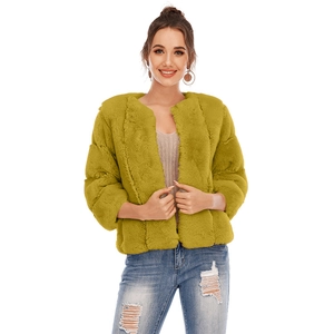 Close-up of ginger faux fur texture on elegant short round neck cropped jacket