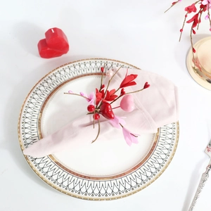 Romantic heart and flower napkin ring set on a table for Valentine's Day dinner decoration