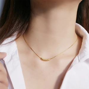 Minimalist 18K gold plated stainless steel necklace with geometric curved tube pendant