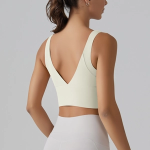 Close-up of V-shaped open back sports bra in cream white with wide supportive band