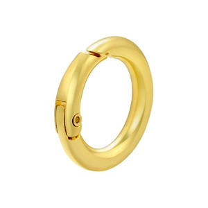 Close-up of a high-polish 18K gold-plated spring ring clasp for DIY jewelry making