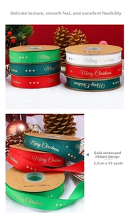 Detail of green and red Merry Christmas ribbons with gold foil lettering and star motifs