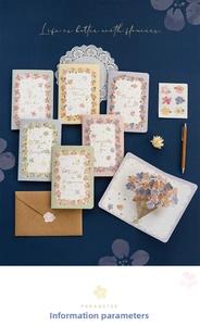 Flat lay of 3D floral greeting cards set with envelopes and decorative petal stickers